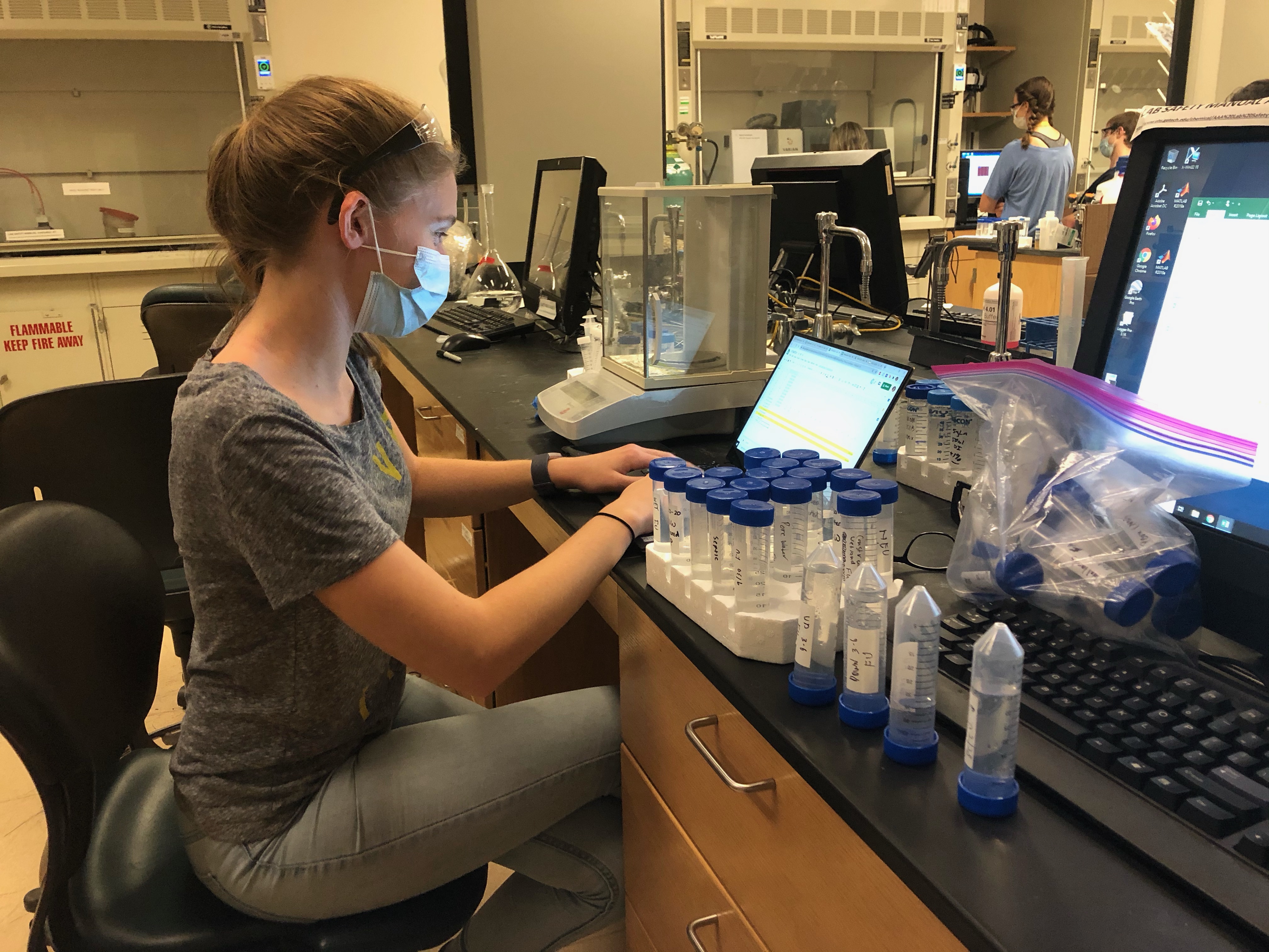 Team Member L. Bricker analyzing water samples